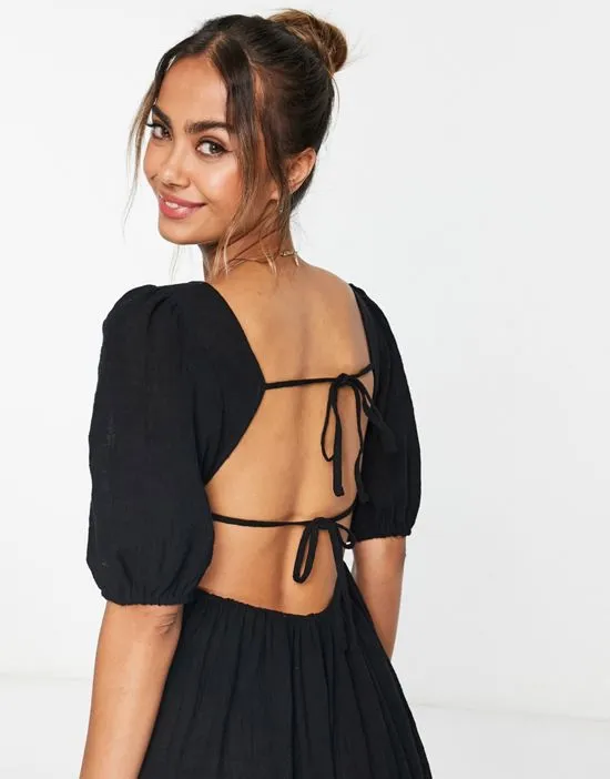 https://images.styletyx.com/images/open-back-beach-dress-in-black-urban-threads-13313880_3.webp
