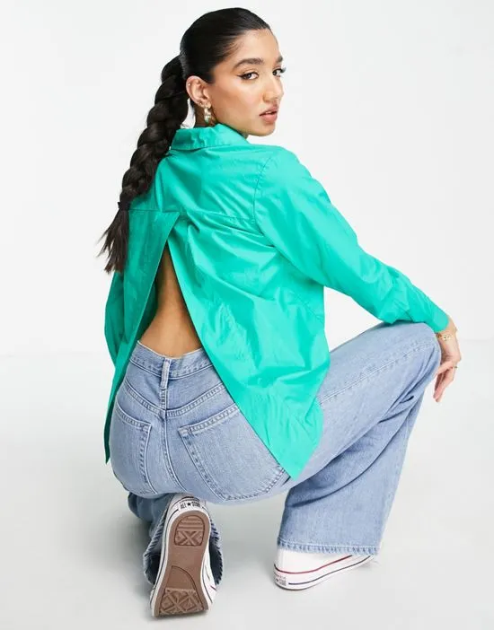 https://images.styletyx.com/images/open-back-shirt-in-bright-green-pieces-1883668_2.webp