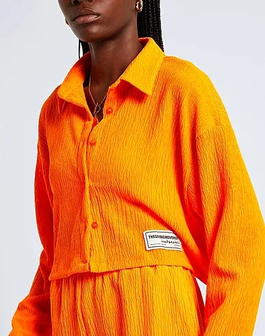 https://images.styletyx.com/images/orange-crepe-solid-color-shirts-blouses-the-giving-movement-x-yoox-2742884_5.webp