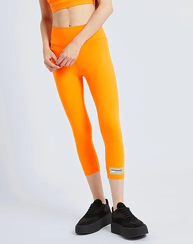 https://images.styletyx.com/images/orange-synthetic-fabric-leggings-the-giving-movement-x-yoox-2944578_5.webp