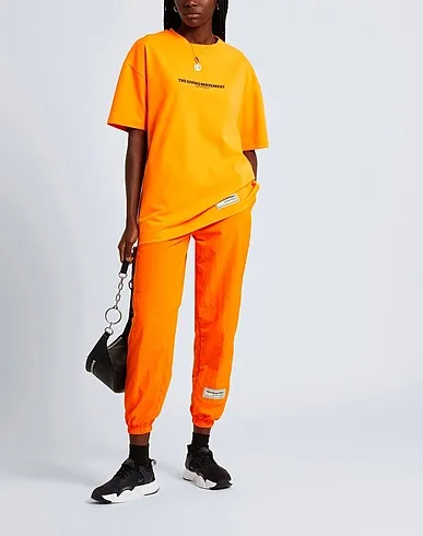 https://images.styletyx.com/images/orange-synthetic-fabric-t-shirt-the-giving-movement-x-yoox-2940432_2.webp
