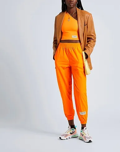 https://images.styletyx.com/images/orange-synthetic-fabric-top-the-giving-movement-x-yoox-1374843_4.webp