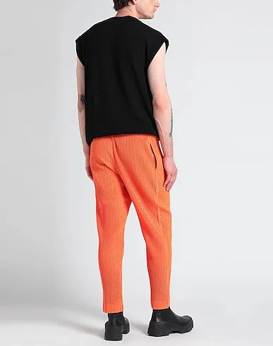 https://images.styletyx.com/images/orange-techno-fabric-casual-pants-homme-plisse-by-issey-miyake-1004124641_3.webp