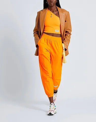 https://images.styletyx.com/images/orange-techno-fabric-casual-pants-the-giving-movement-x-yoox-2063997_2.webp