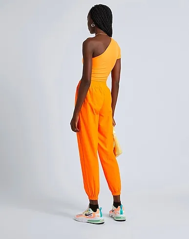 https://images.styletyx.com/images/orange-techno-fabric-casual-pants-the-giving-movement-x-yoox-2063997_3.webp