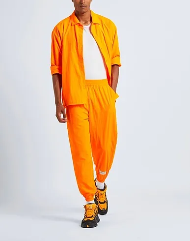 https://images.styletyx.com/images/orange-techno-fabric-casual-pants-the-giving-movement-x-yoox-2063997_4.webp