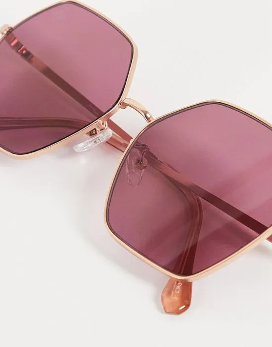 https://images.styletyx.com/images/oversized-hex-sunglasses-in-gold-with-blush-lens-jeepers-peepers-13455010_3.webp
