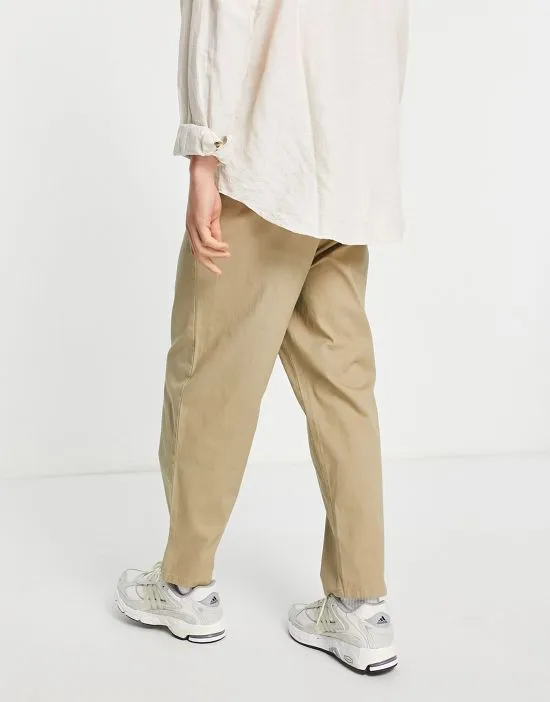 https://images.styletyx.com/images/oversized-tapered-chinos-in-light-khaki-asos-design-2714871_2.webp