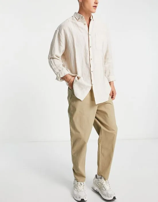 https://images.styletyx.com/images/oversized-tapered-chinos-in-light-khaki-asos-design-2714871_3.webp