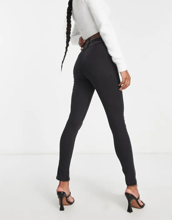 https://images.styletyx.com/images/petite-contrast-stitch-split-hem-skinny-jean-in-black-miss-selfridge-3047546_2.webp