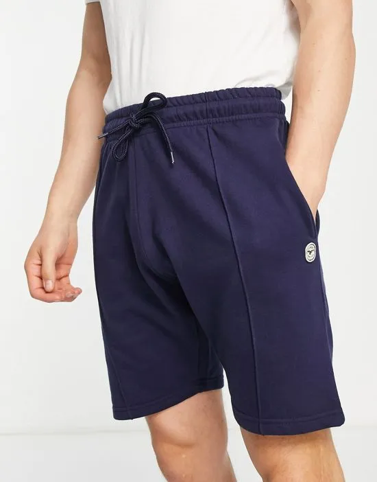 https://images.styletyx.com/images/pin-tuck-jersey-shorts-in-navy-le-breve-13600549_1.webp