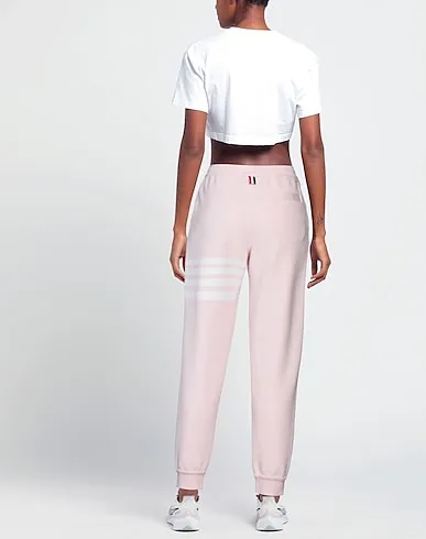 https://images.styletyx.com/images/pink-jersey-casual-pants-thom-browne-3197818_3.webp