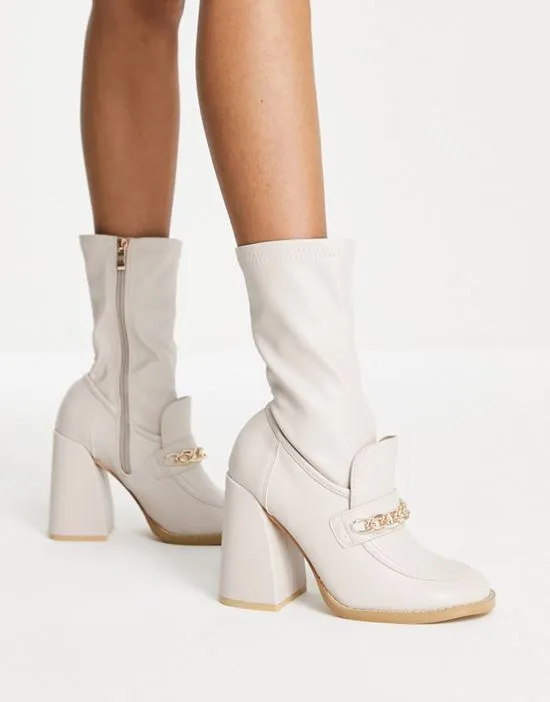 https://images.styletyx.com/images/piper-slim-block-heel-loafer-boots-in-cream-koi-footwear-1929722_3.webp