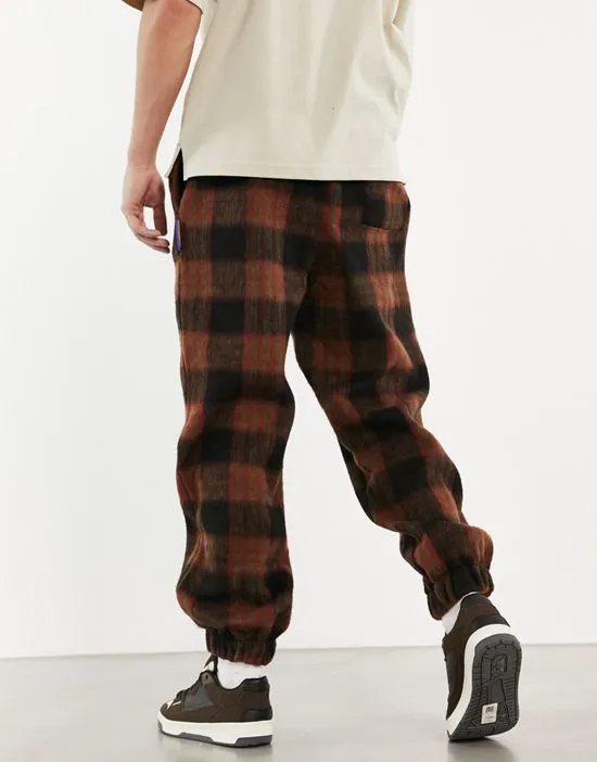 https://images.styletyx.com/images/plaid-teddy-sweatpants-in-brown-part-of-a-set-damson-madder-13000190_2.webp