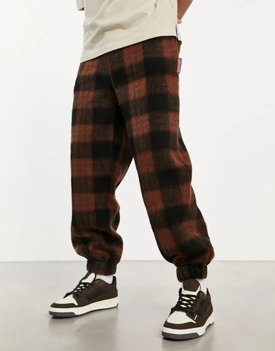 https://images.styletyx.com/images/plaid-teddy-sweatpants-in-brown-part-of-a-set-damson-madder-13000190_3.webp
