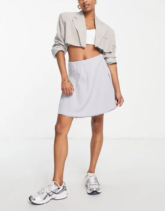 https://images.styletyx.com/images/pleated-tailored-mini-skirt-in-light-blue-missguided-petite-2034693_3.webp