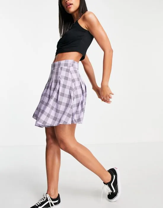https://images.styletyx.com/images/pleated-tennis-mini-skirt-in-lilac-check-lola-may-2490409_4.webp
