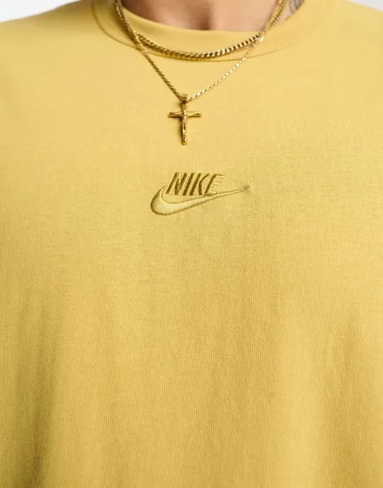 https://images.styletyx.com/images/premium-essential-sust-t-shirt-in-gold-nike-870830342_2.webp