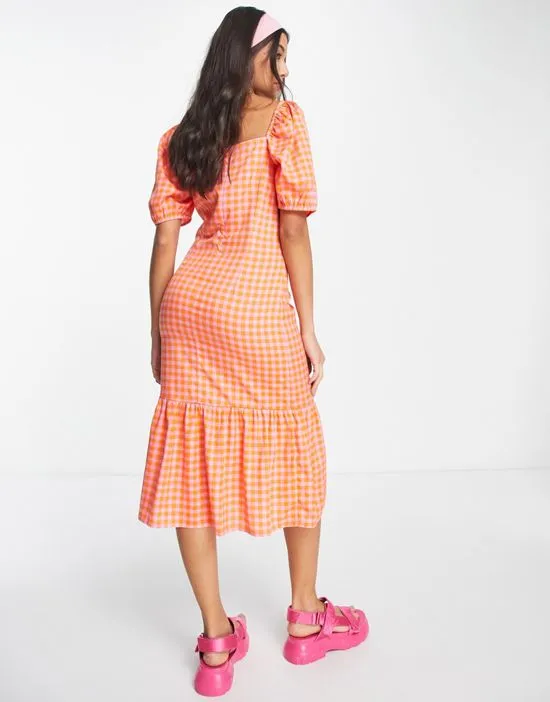 https://images.styletyx.com/images/puff-sleeve-midi-smock-dress-with-tiered-skirt-in-bright-gingham-wednesday-s-girl-1831098_3.webp