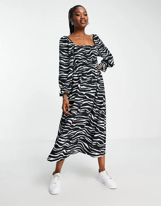 https://images.styletyx.com/images/puff-sleeve-zebra-print-midi-dress-in-black-new-look-3237875_4.webp