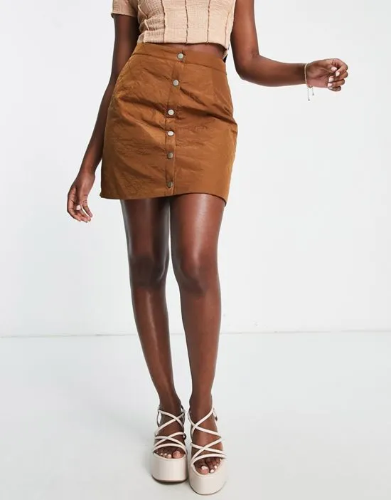 https://images.styletyx.com/images/quilted-button-through-mini-skirt-in-brown-lola-may-2766948_3.webp