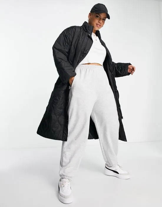 https://images.styletyx.com/images/quilted-longline-puffer-coat-in-black-missguided-plus-2906019_4.webp