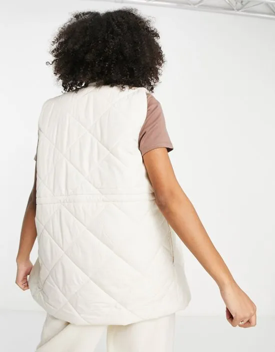 https://images.styletyx.com/images/quilted-vest-in-cream-pieces-2489287_2.webp