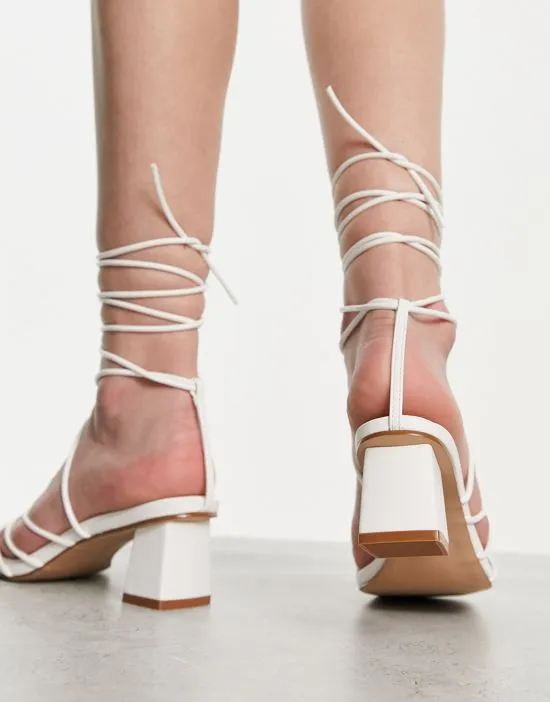 https://images.styletyx.com/images/raid-lycia-strappy-mid-heeled-sandals-in-white-raid-13447567_2.webp