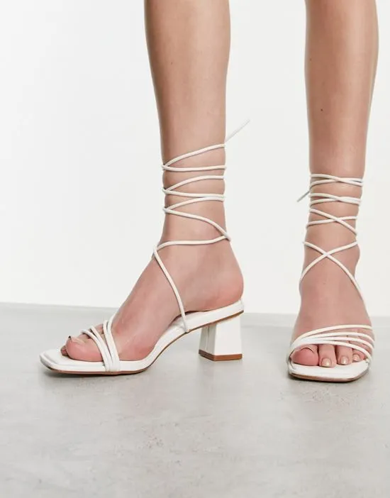 https://images.styletyx.com/images/raid-lycia-strappy-mid-heeled-sandals-in-white-raid-13447567_4.webp
