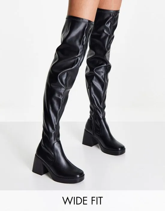 https://images.styletyx.com/images/raid-wide-fit-joyen-knee-high-stretch-boots-with-mid-heel-in-black-raid-wide-fit-2600014_1.webp