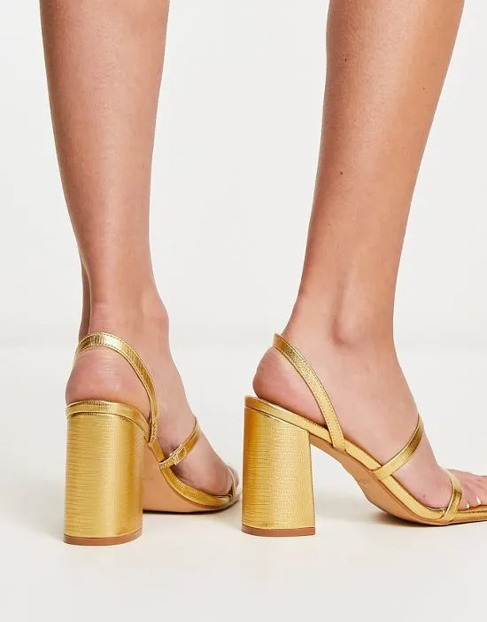 https://images.styletyx.com/images/raid-wide-fit-libra-block-heeled-sandals-in-gold-lizard-raid-wide-fit-13250518_2.webp