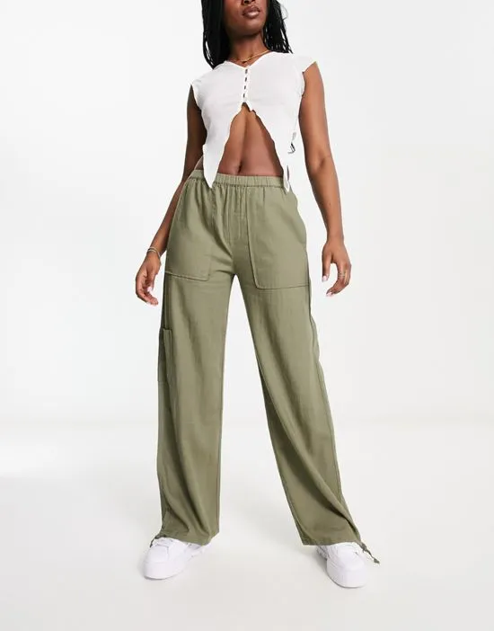 https://images.styletyx.com/images/relaxed-linen-pants-in-khaki-pull-bear-13207755_1.webp