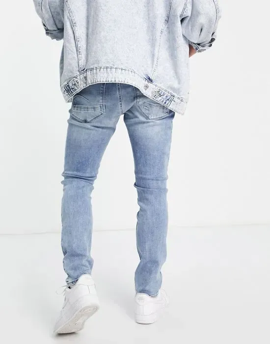 https://images.styletyx.com/images/revend-distressed-skinny-jean-in-light-wash-g-star-13708963_2.webp