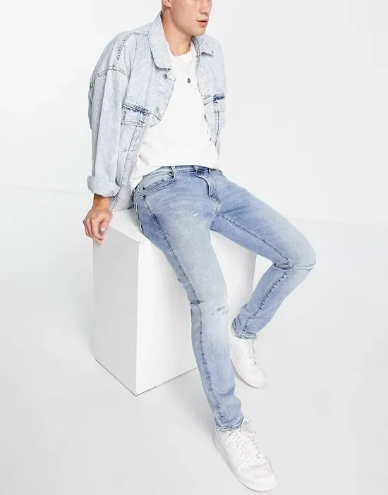 https://images.styletyx.com/images/revend-distressed-skinny-jean-in-light-wash-g-star-13708963_4.webp