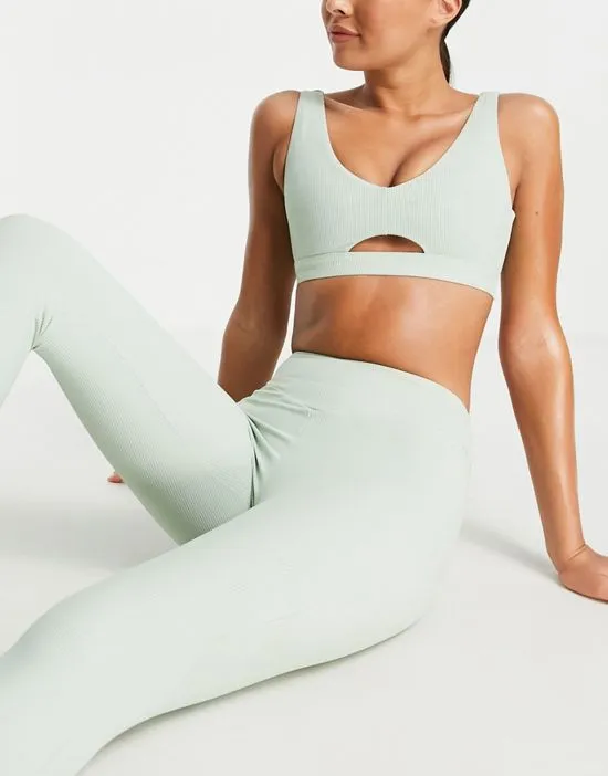 https://images.styletyx.com/images/rib-light-support-cutout-sports-bra-in-sage-green-south-beach-2700402_4.webp