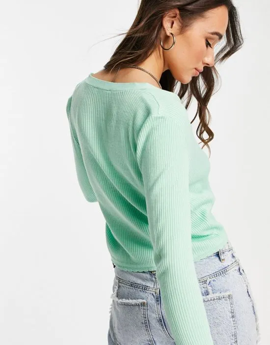 https://images.styletyx.com/images/ribbed-cardigan-with-tie-front-in-mint-green-vila-1768850_3.webp