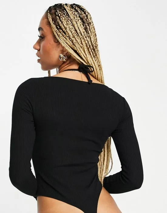 https://images.styletyx.com/images/ring-detail-halter-long-sleeved-bodysuit-in-black-asos-design-2754294_2.webp