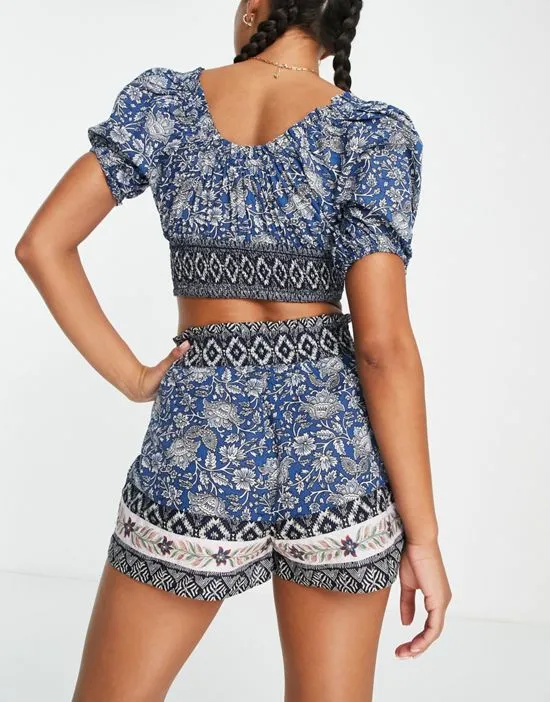 https://images.styletyx.com/images/river-island-cut-out-puff-sleeve-printed-bardot-beach-top-in-blue-part-of-a-set-river-island-13274171_4.webp