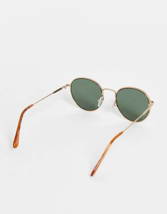 https://images.styletyx.com/images/round-sunglasses-in-gold-selected-homme-2590970_2.webp