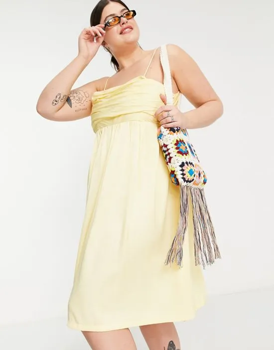 https://images.styletyx.com/images/ruched-cami-midi-dress-in-lemon-yellow-the-frolic-plus-1818593_2.webp