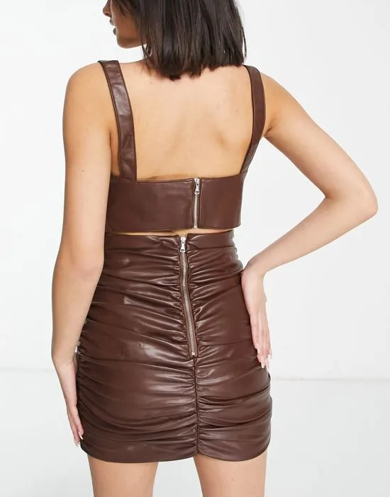 https://images.styletyx.com/images/ruched-pu-mini-skirt-in-chocolate-brown-part-of-a-set-bardot-3299859_2.webp