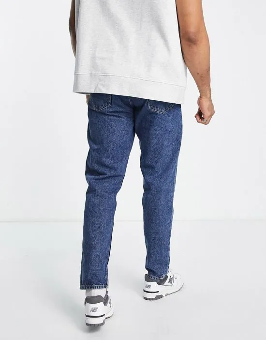 https://images.styletyx.com/images/rush-tapered-jeans-in-mid-wash-dr-denim-1836300_2.webp