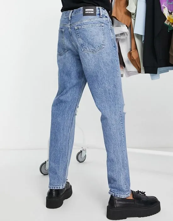 https://images.styletyx.com/images/rush-tapered-knee-ripped-jeans-in-mid-wash-dr-denim-1835326_2.webp