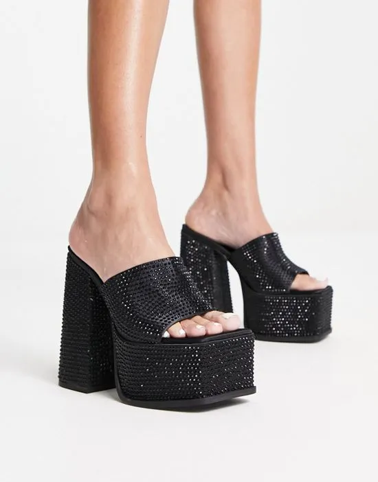 https://images.styletyx.com/images/sagittarius-platform-heeled-sandals-in-black-shimmer-shellys-london-12909870_1.webp