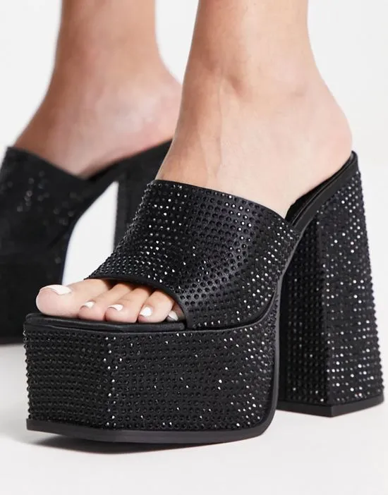 https://images.styletyx.com/images/sagittarius-platform-heeled-sandals-in-black-shimmer-shellys-london-12909870_3.webp