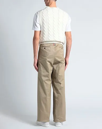 https://images.styletyx.com/images/sand-cotton-twill-casual-pants-thom-browne-13242833_3.webp