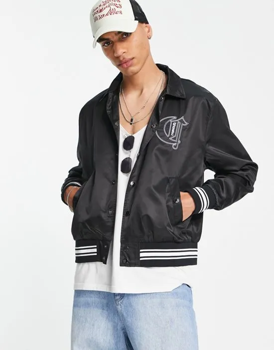 https://images.styletyx.com/images/satin-bomber-jacket-with-varsity-badging-in-black-the-couture-club-1813706_1.webp
