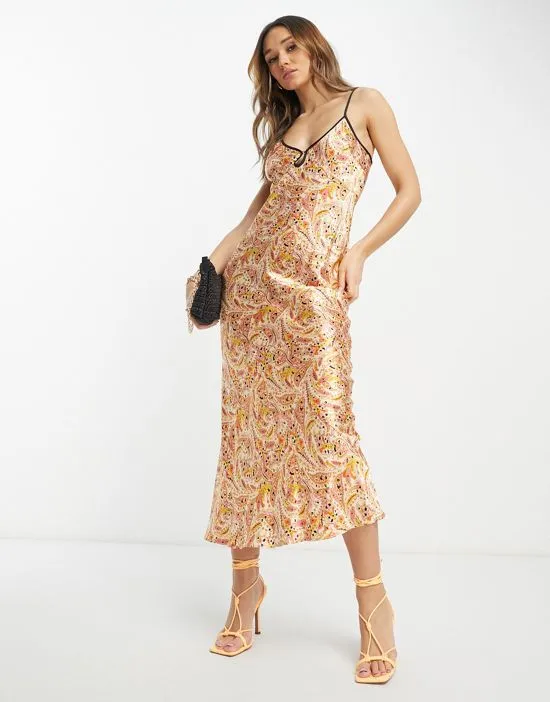 https://images.styletyx.com/images/satin-slip-dress-in-paisley-print-never-fully-dressed-13253334_4.webp