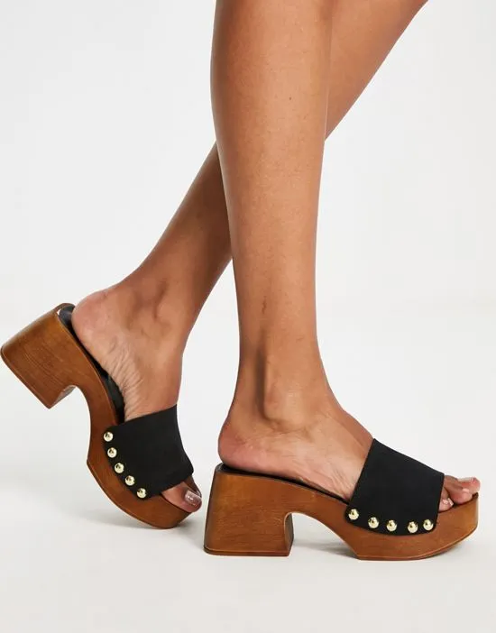 https://images.styletyx.com/images/schuh-tanika-suede-clog-sandals-in-black-schuh-13276737_1.webp