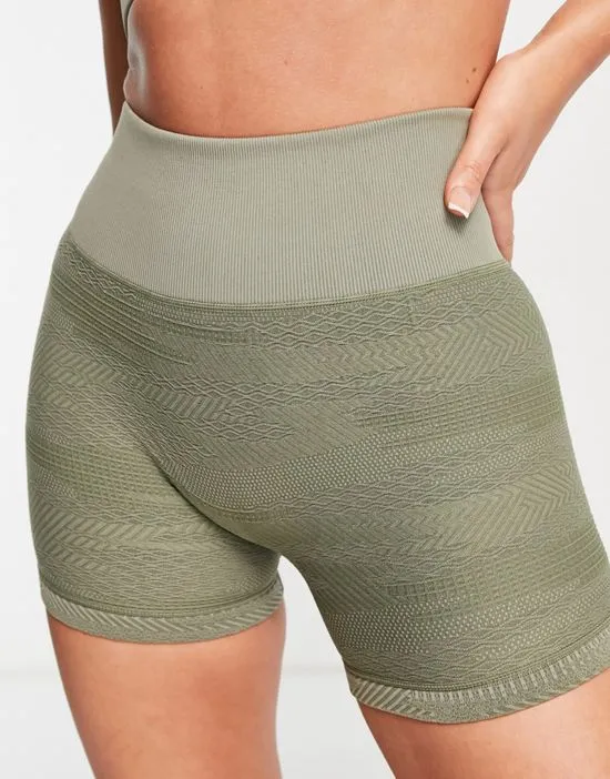 https://images.styletyx.com/images/seamless-booty-shorts-in-textured-camo-in-khaki-hiit-2398279_1.webp